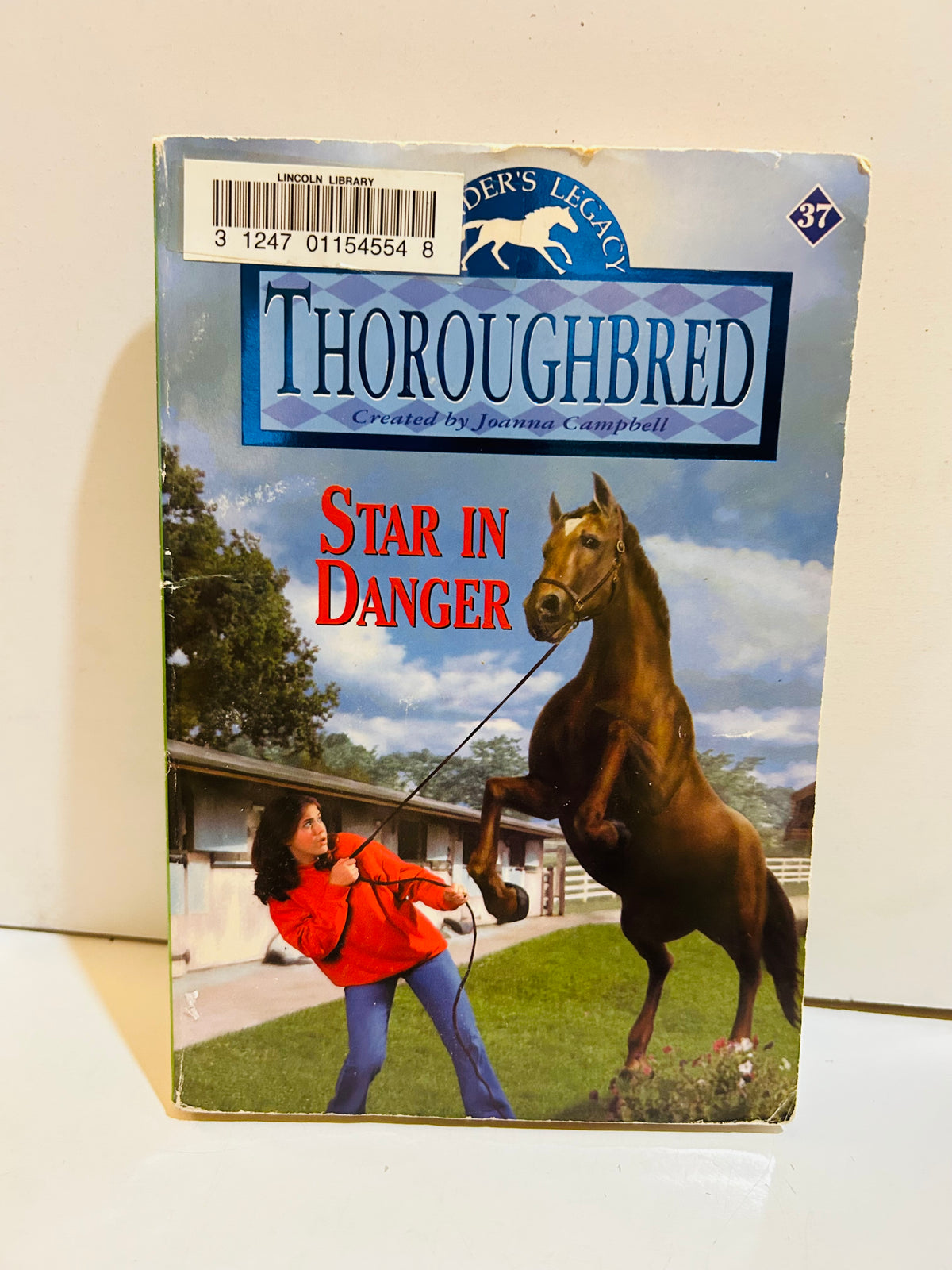 Thoroughbred number 37 Star in Danger paperback with ex-library label and visible cover wear