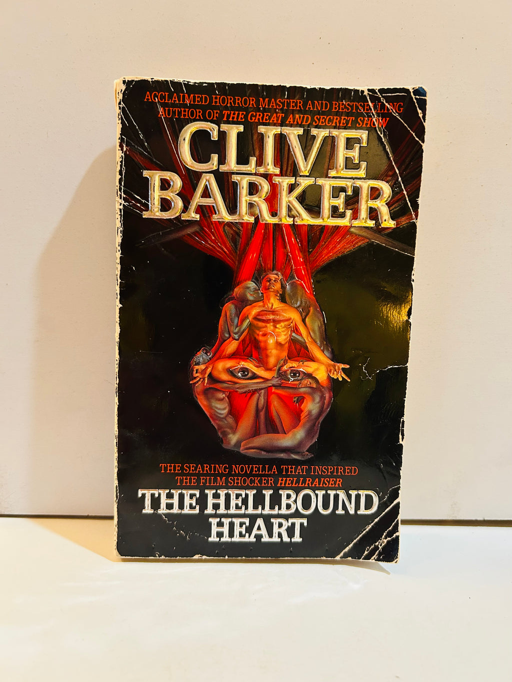 Clive Barker The Hellbound Heart paperback front cover showing creasing and edge wear