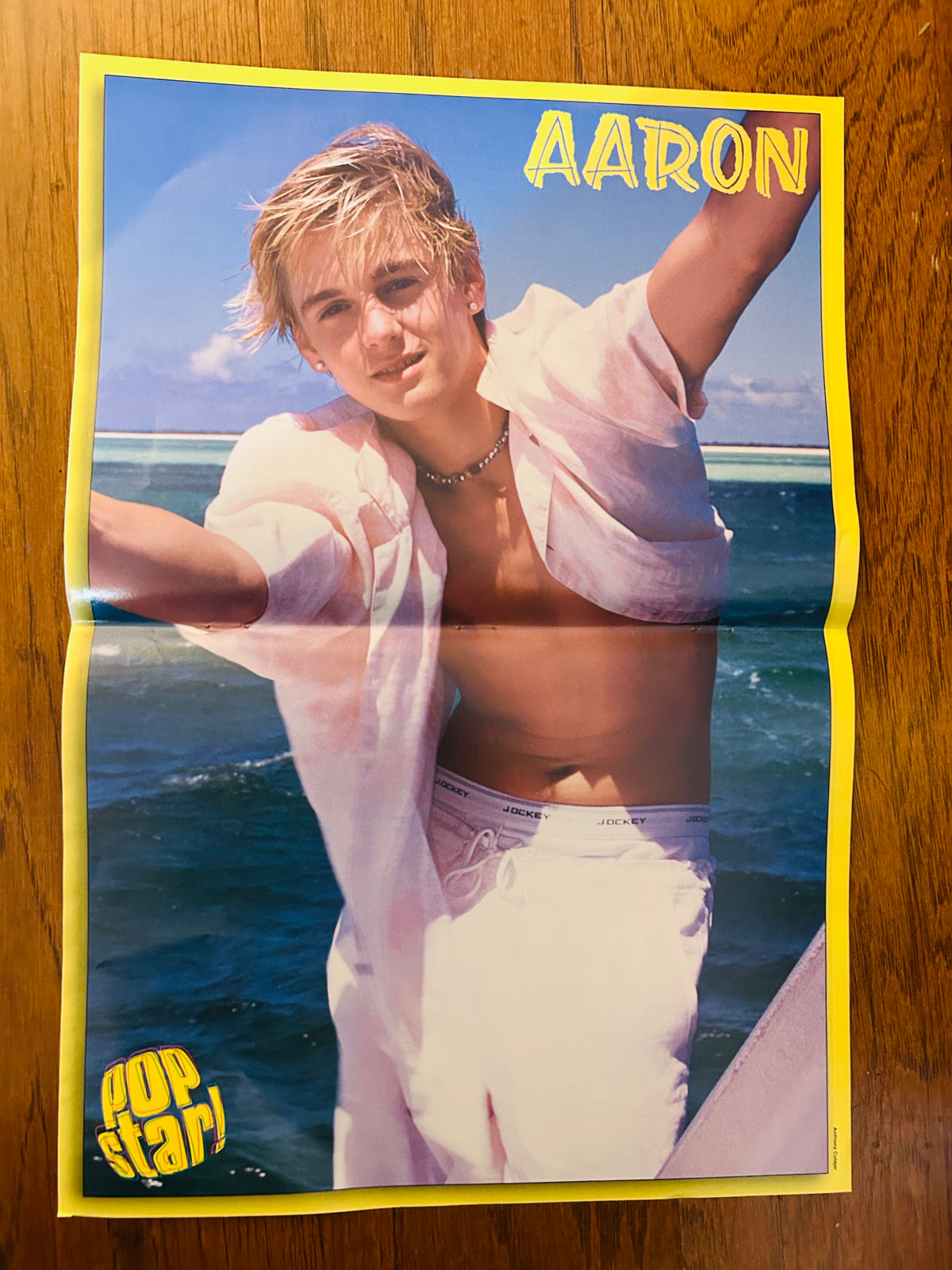 Aaron Carter Pop Star poster yellow-bordered side featuring Aaron by the water