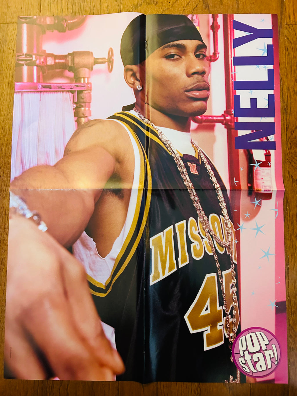 Nelly side of double-sided Pop Star poster with fold creases