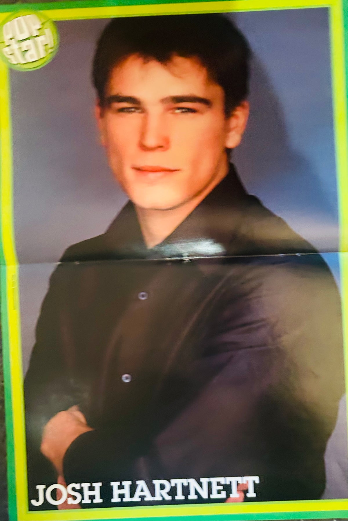 Pop Star! magazine double-sided poster side B featuring Josh Hartnett moody close-up portrait in dark button-up shirt with arms crossed against blue-grey background, JOSH HARTNETT in white font bottom center, yellow-green border, Pop Star logo top left