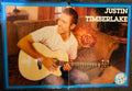 Pop Star! magazine double-sided poster side A featuring Justin Timberlake sitting on sofa smiling playing acoustic guitar in white t-shirt and jeans with blue border, Pop Star logo bottom right, tear visible at top center