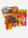 The Simpsons 4-piece collectibles gift set including Character Bandz, FilmCardz, bubble gum cards, and a family pin-back button