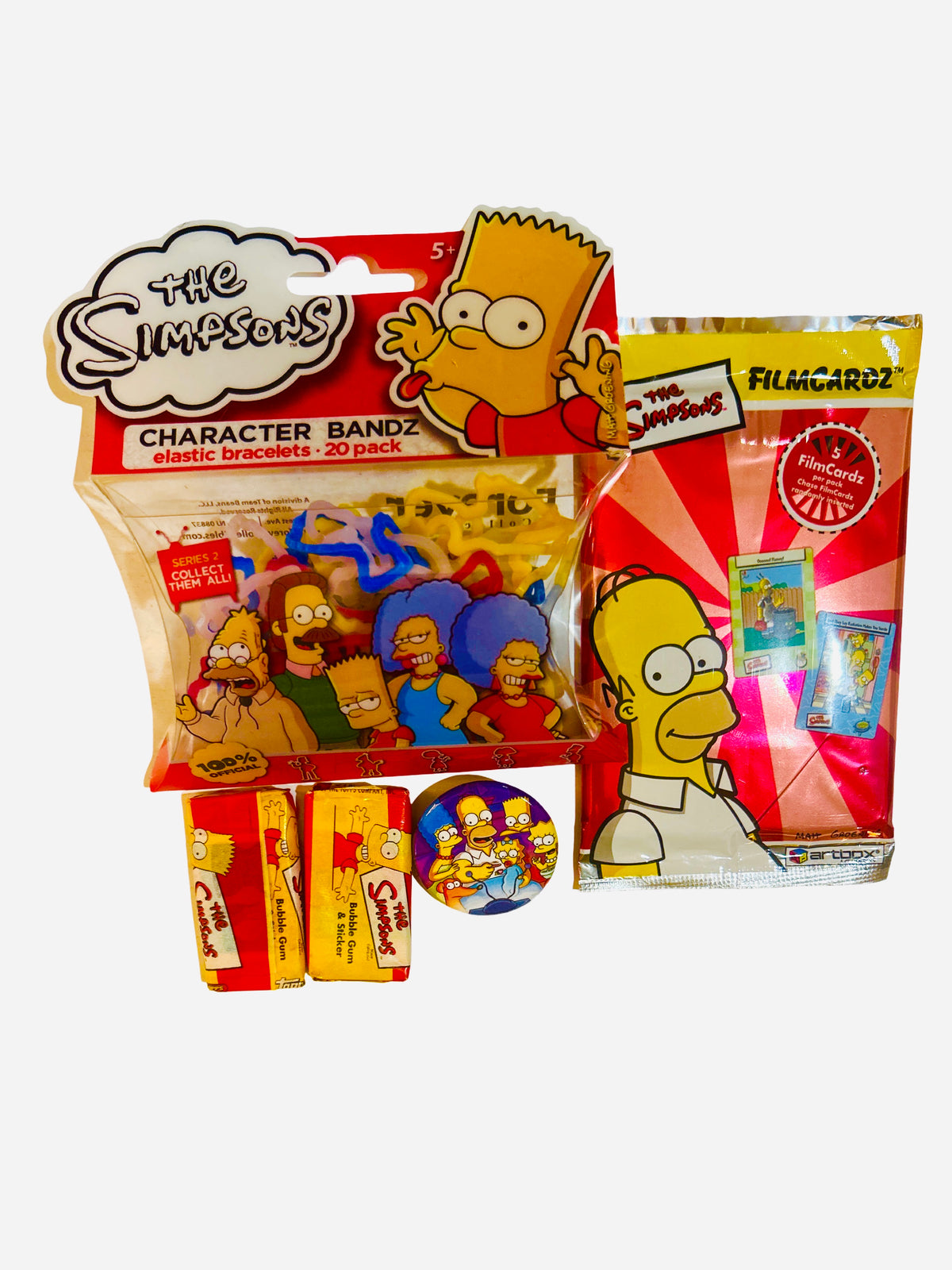 The Simpsons 4-piece collectibles gift set including Character Bandz, FilmCardz, bubble gum cards, and a family pin-back button