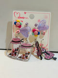 5-pair kawaii earring set on display card featuring purple heart studs, colorful pom-pom studs, rose studs, heart jar drop earrings, and leopard print vanity drop earrings