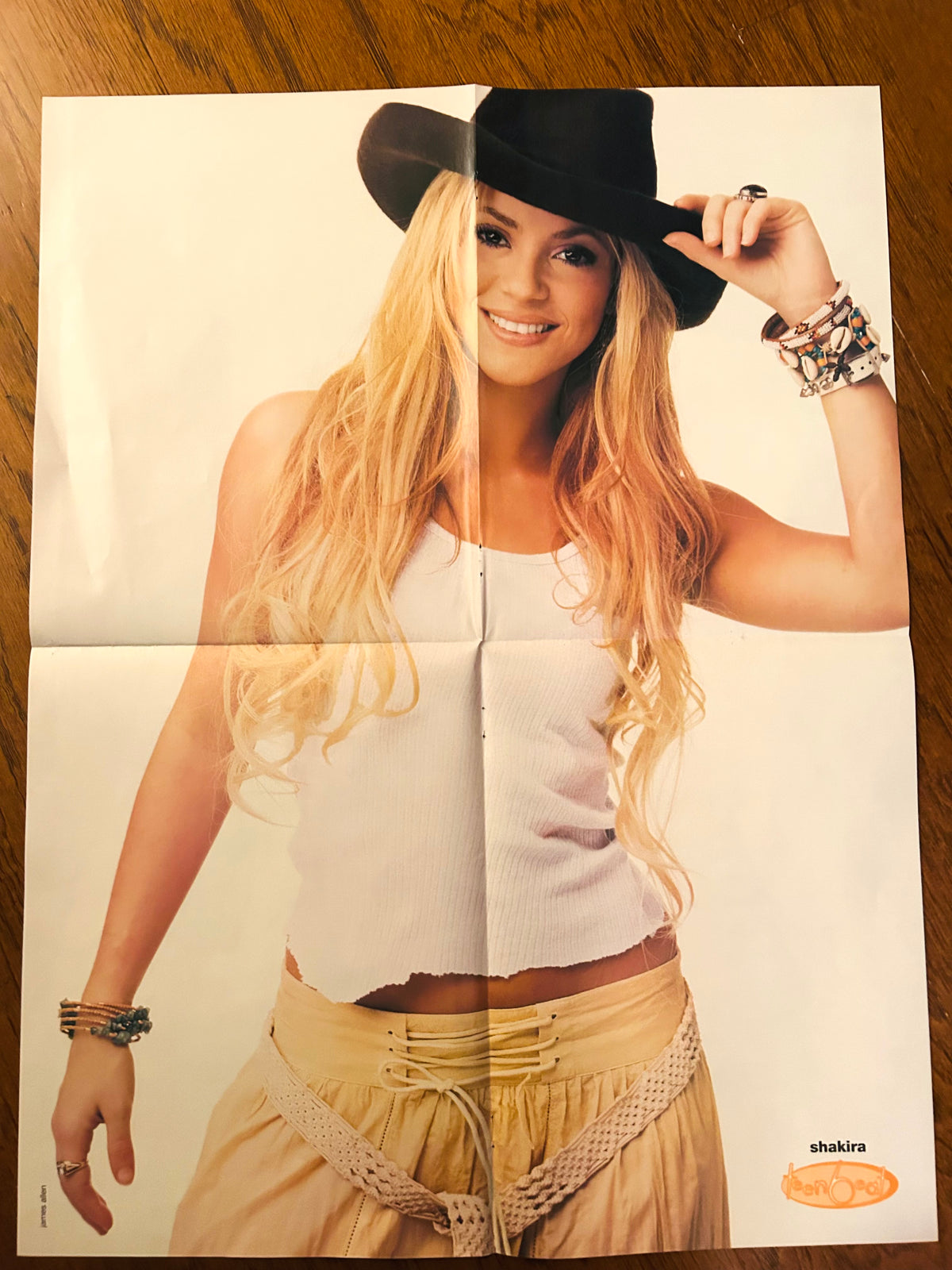 Shakira side of 2002 Teen People double-sided poster, wearing a black cowboy hat