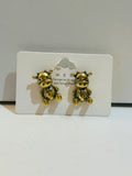 Pair of antique gold-tone seated cow character stud earrings with 925 silver posts on display card, Korean design