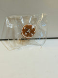Miniature round cake resin charm with LV-style monogram pattern in brown and white, sealed in clear clamshell packaging