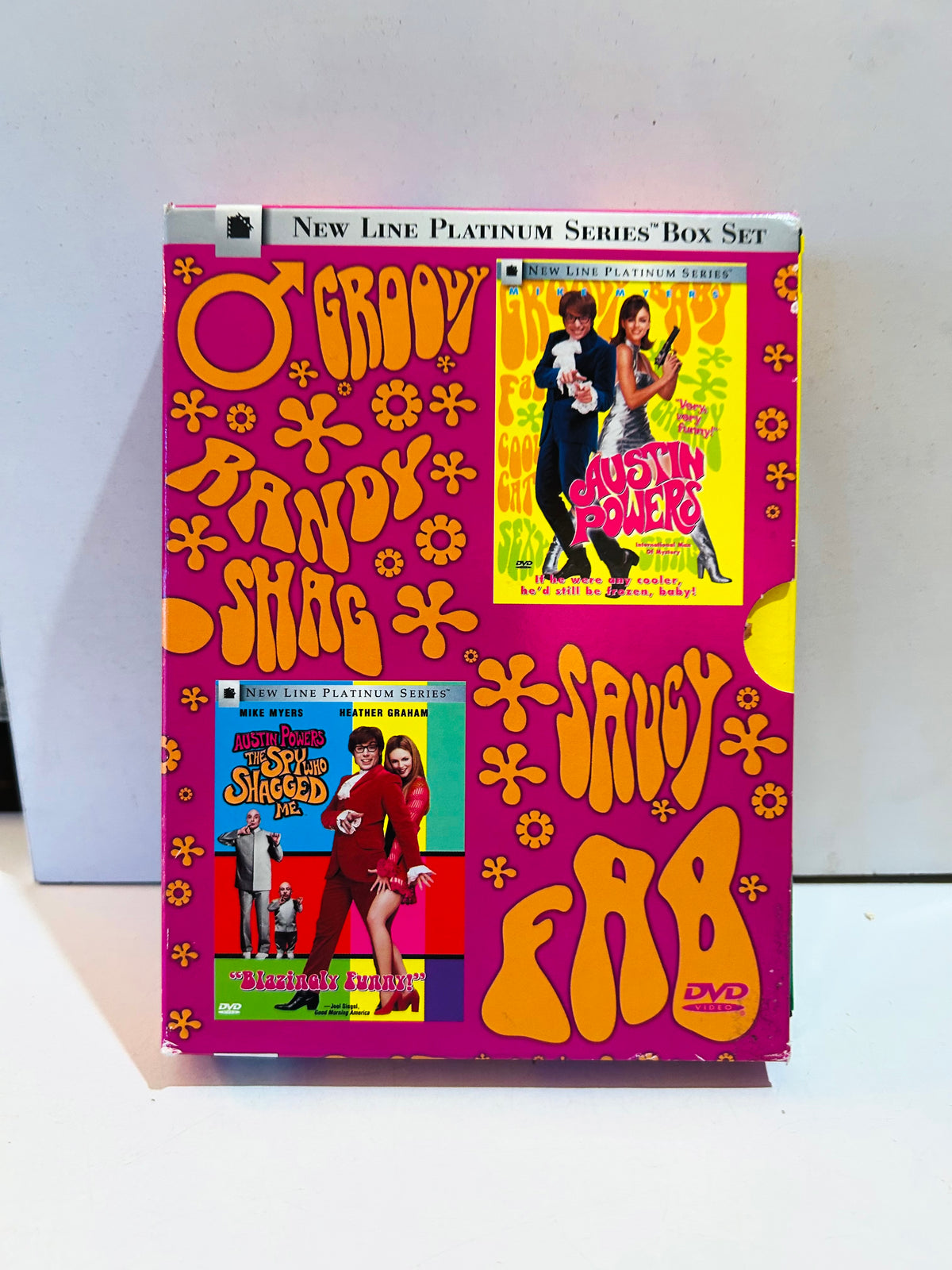 Austin Powers New Line Platinum Series DVD box set with pink and orange packaging showing edge wear