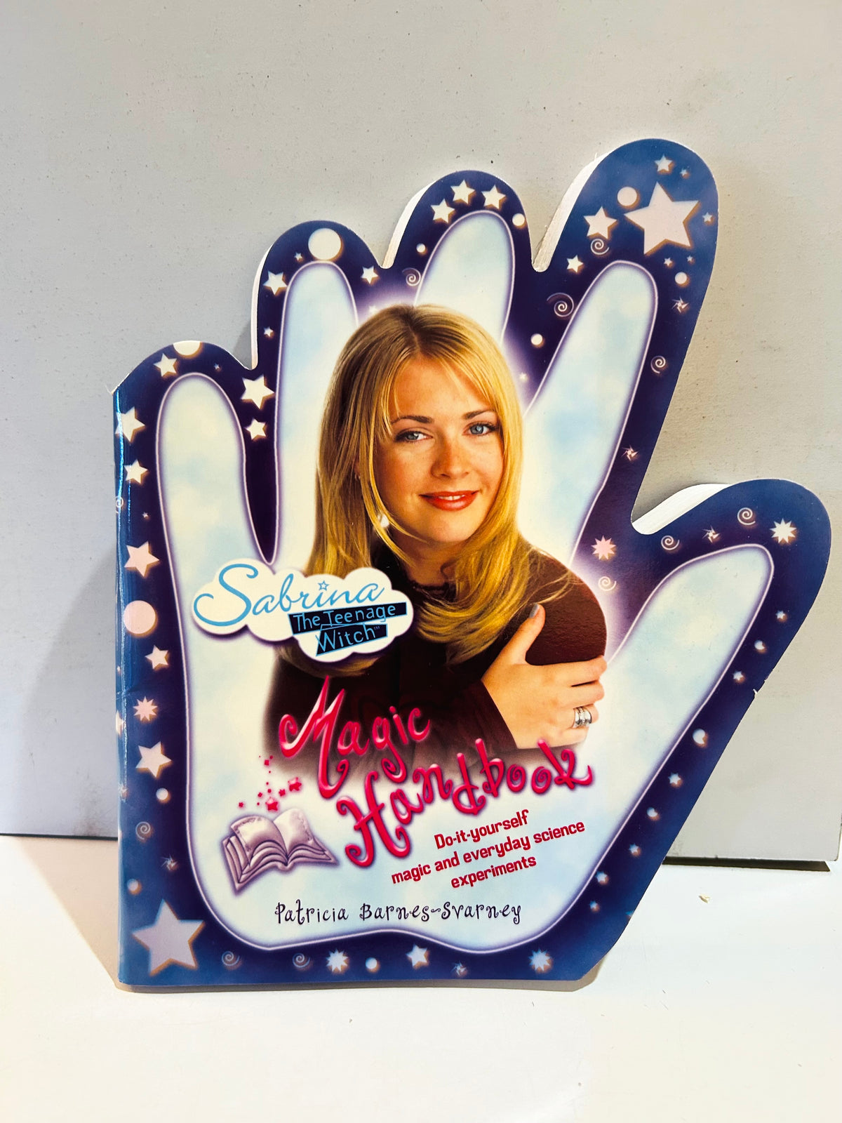 Hand-shaped Sabrina the Teenage Witch Magic Handbook paperback cover with stars