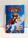 Yu-Gi-Oh GX Game On Scholastic paperback front cover with Includes Poster banner