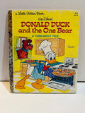 Walt Disney's Donald Duck and the One Bear A Turn-About Tale Little Golden Book 1978 cover featuring Donald Duck in chef hat baking pizza at stove with a bear peering through kitchen window, yellow background, item 102-33