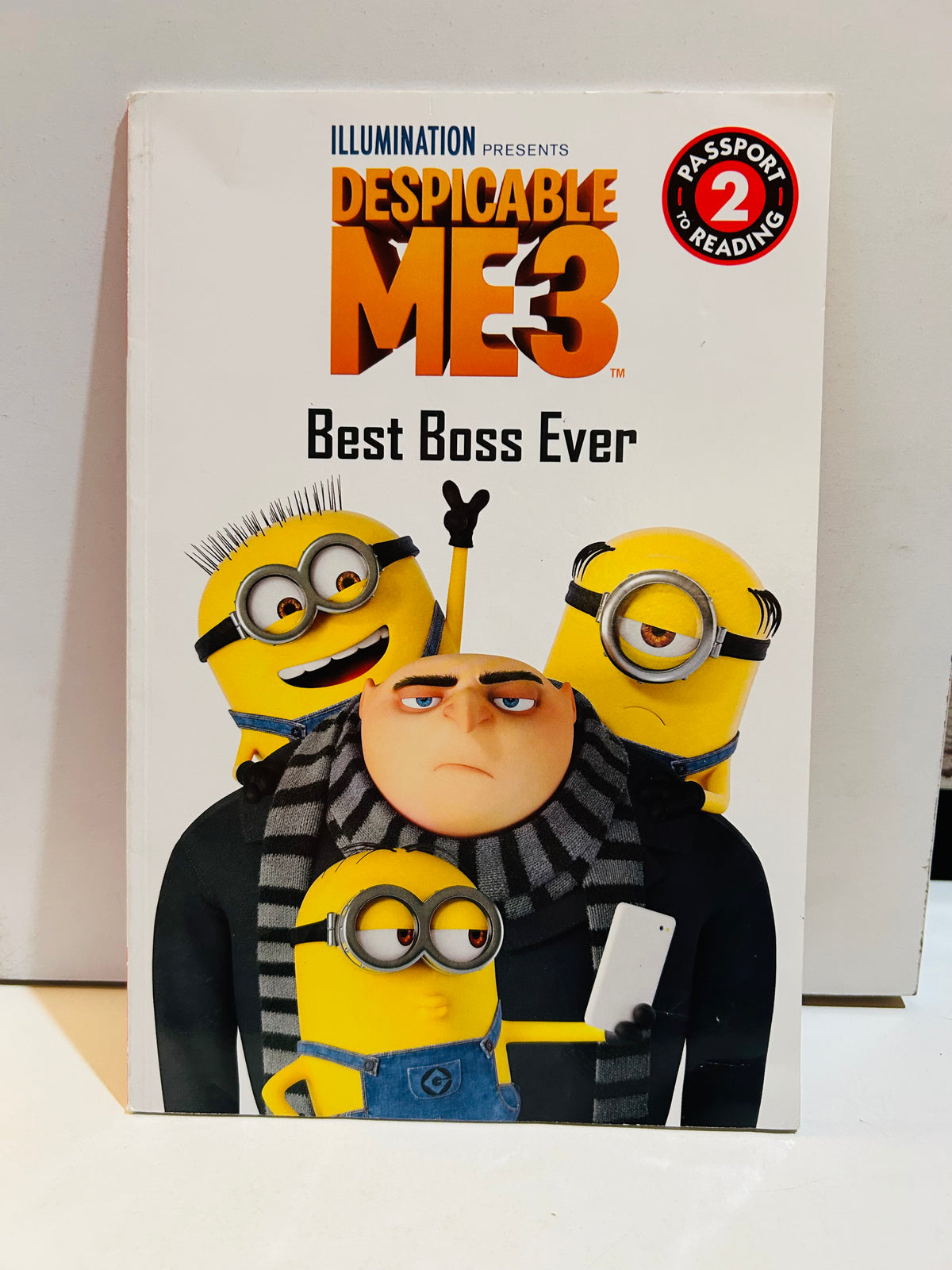 Despicable Me 3 Best Boss Ever paperback book cover featuring Gru and three Minions, Illumination Passport to Reading Level 2