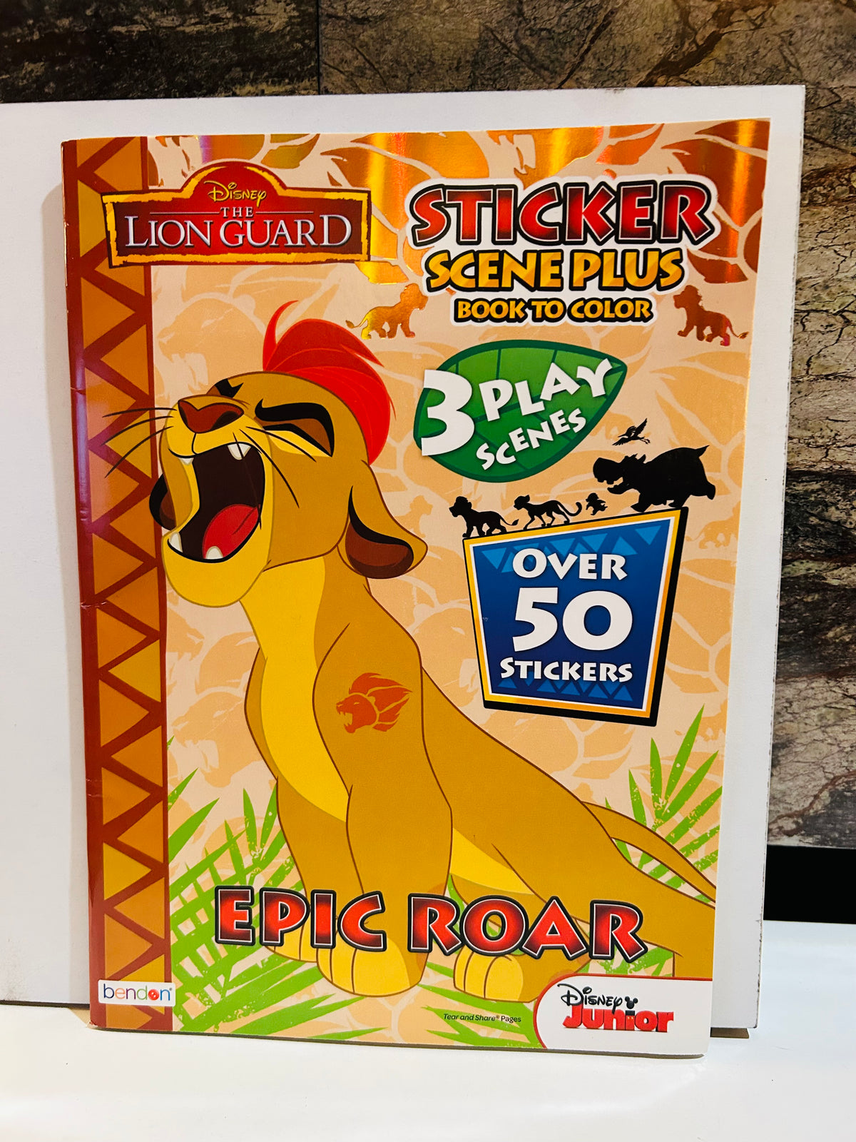 Disney The Lion Guard Epic Roar Sticker Scene Plus Book to Color featuring Kion roaring, published by Bendon for Disney Junior, includes 3 play scenes and over 50 stickers
