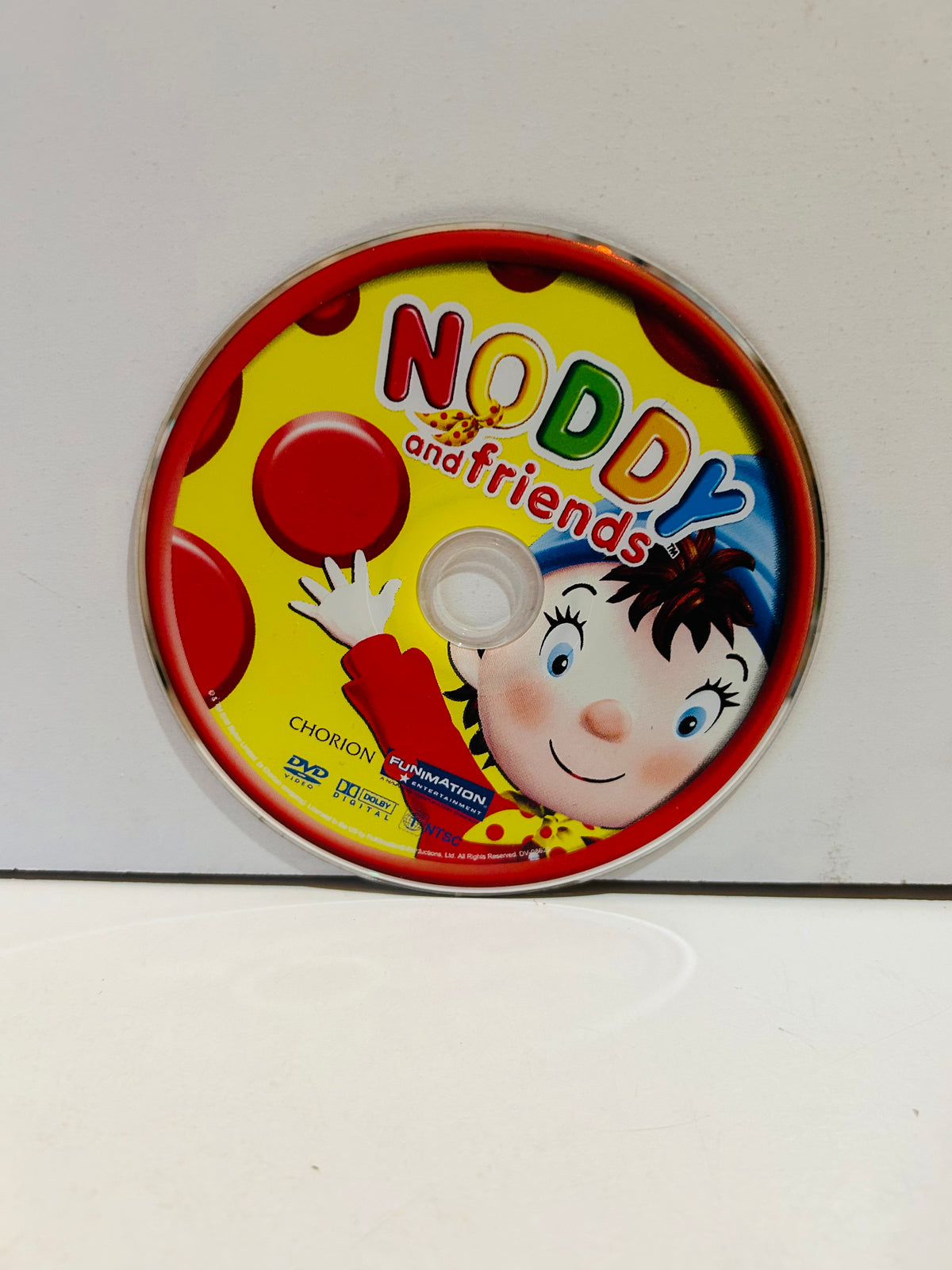 Noddy and Friends DVD disc label close-up showing Noddy character smiling with red balloons on yellow background with red border Chorion Funimation Entertainment DVD Dolby Digital logos