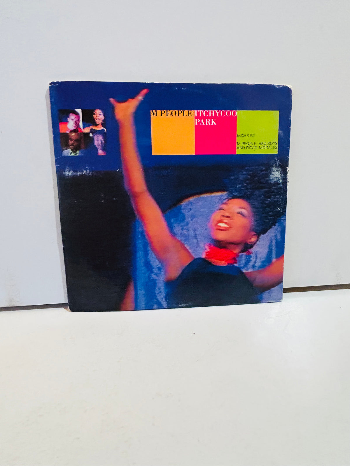 M People Itchycoo Park 12 inch vinyl single 1996 cardboard sleeve cover featuring Heather Small with arm raised smiling, colorful orange yellow green red color blocks with M People Itchycoo Park title, mixes by M People Hed Boys and David Morales
