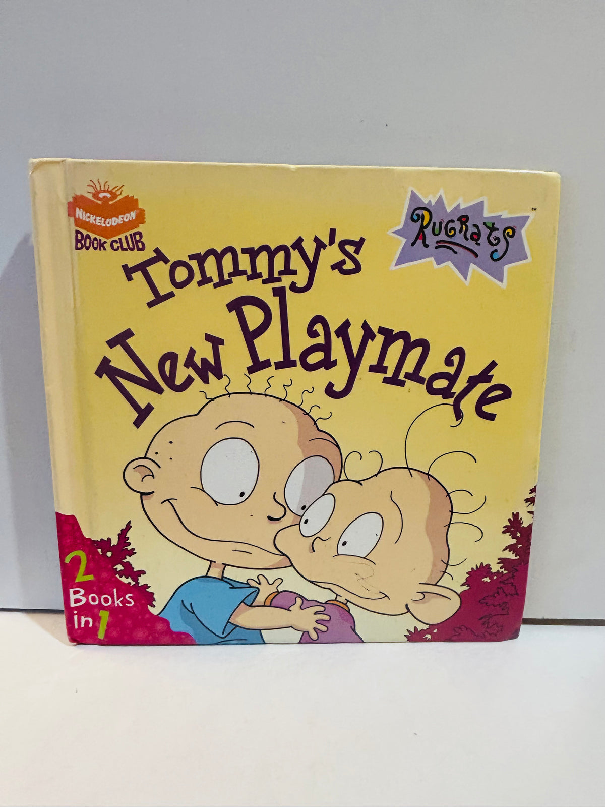 Rugrats Tommy's New Playmate 8x8 hardcover book Nickelodeon Book Club 2 Books in 1 featuring Tommy Pickles and Dil Pickles on yellow background with Rugrats logo