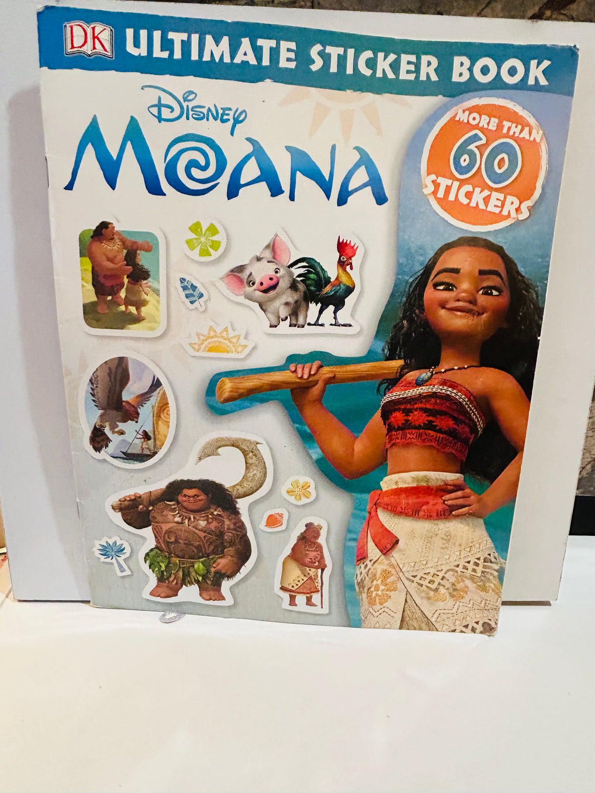 DK Ultimate Sticker Book Disney Moana 2016 cover featuring Moana holding oar with Maui Pua Heihei and other character stickers displayed, More Than 60 Stickers callout badge