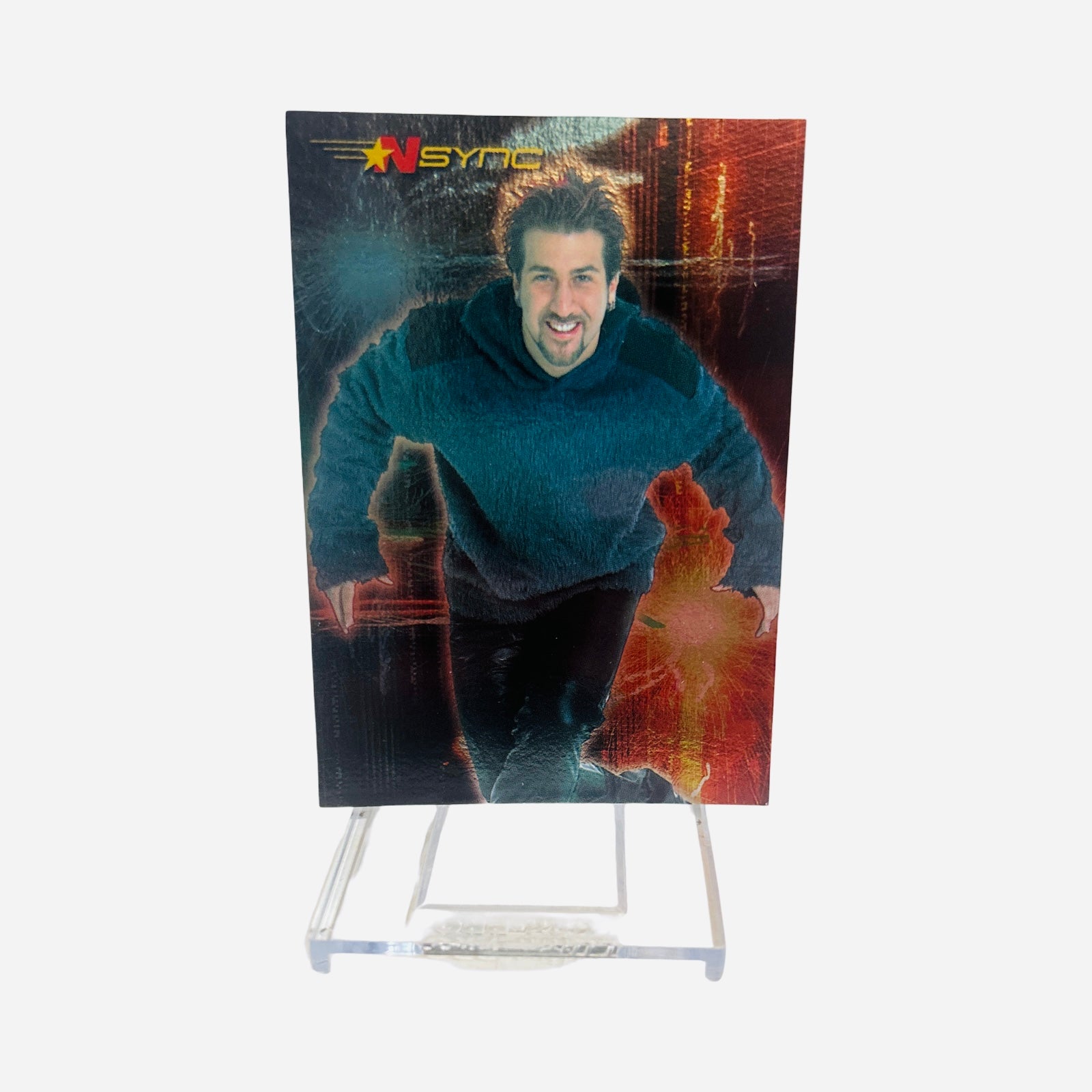 NSYNC Trading Card #15 Front – Joey Fatone Blue Fuzzy Hoodie Smiling Leaning Forward Dark Red Background 2000 Topps Winterland