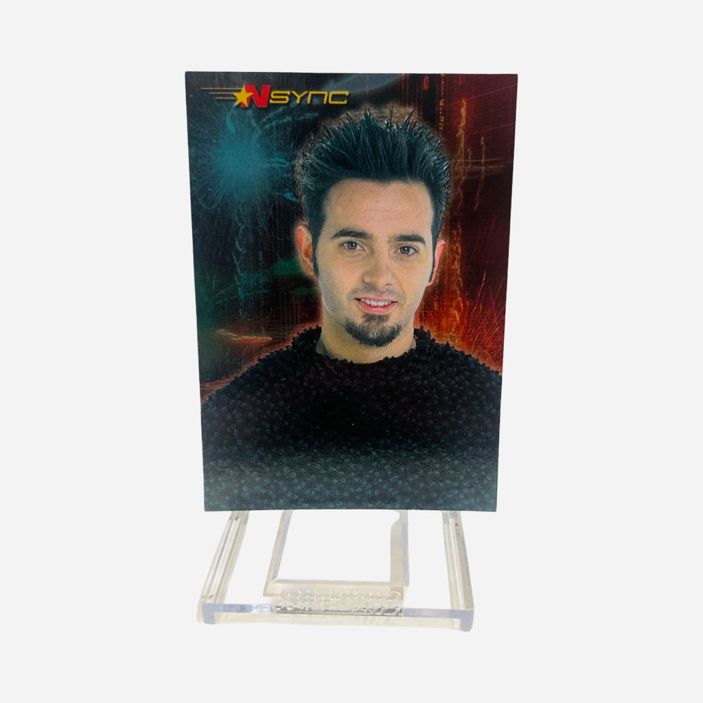 NSYNC Trading Card #18 Front – Chris Kirkpatrick Spiky Dark Hair Goatee Black Sweater Close-Up Portrait Dark Teal Red Background 2000 Topps Winterland