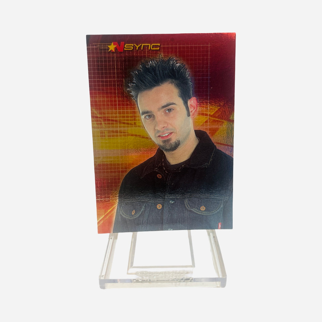 NSYNC Trading Card #30 Front – Chris Kirkpatrick Spiky Dark Hair Goatee Dark Denim Jacket Black Shirt Warm Smile Red Gold Grid Background 2000 Topps Winterland
