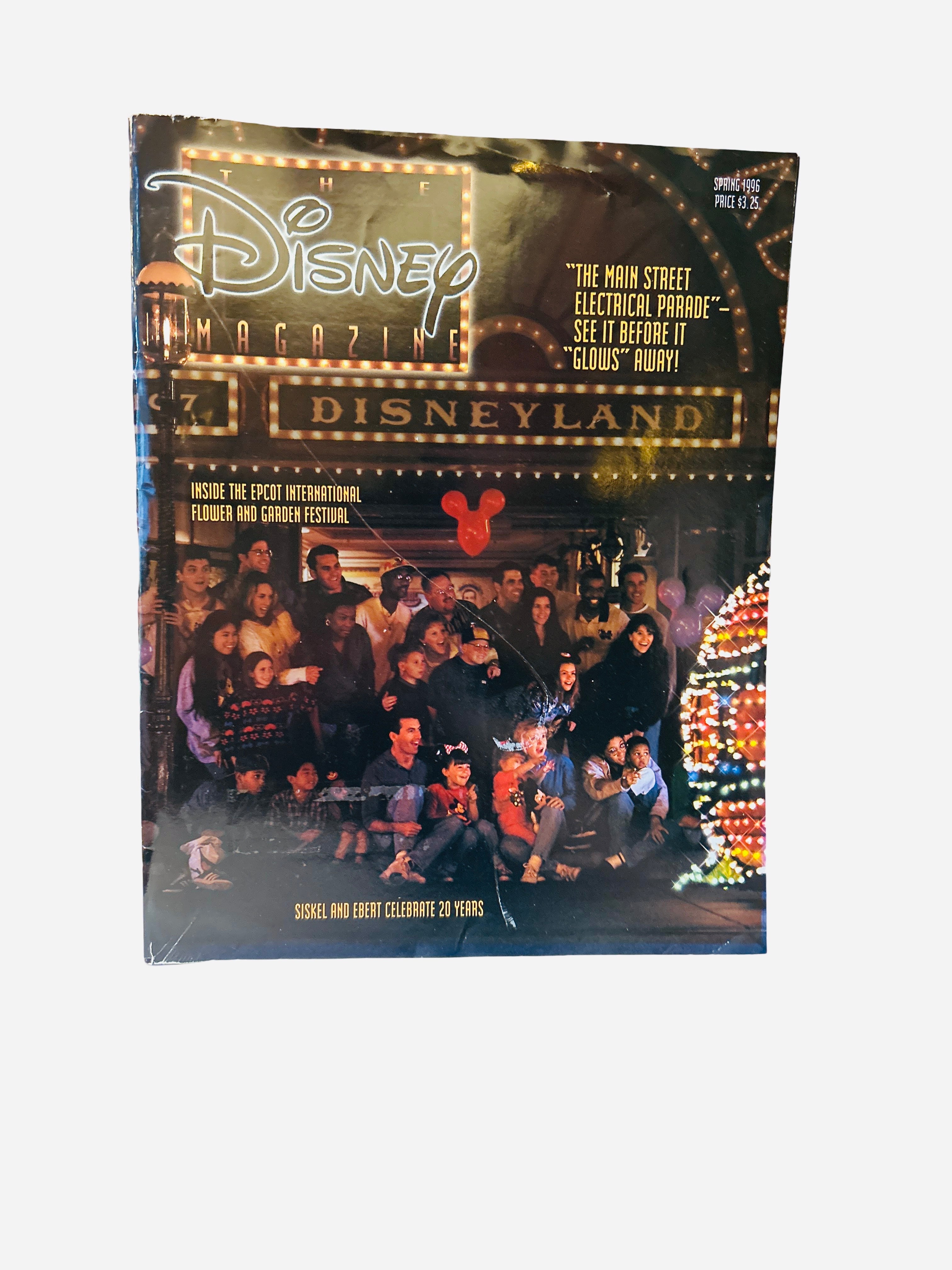 The Disney Magazine Spring 1996 - Cover featuring families watching the Main Street Electrical Parade at Disneyland at night