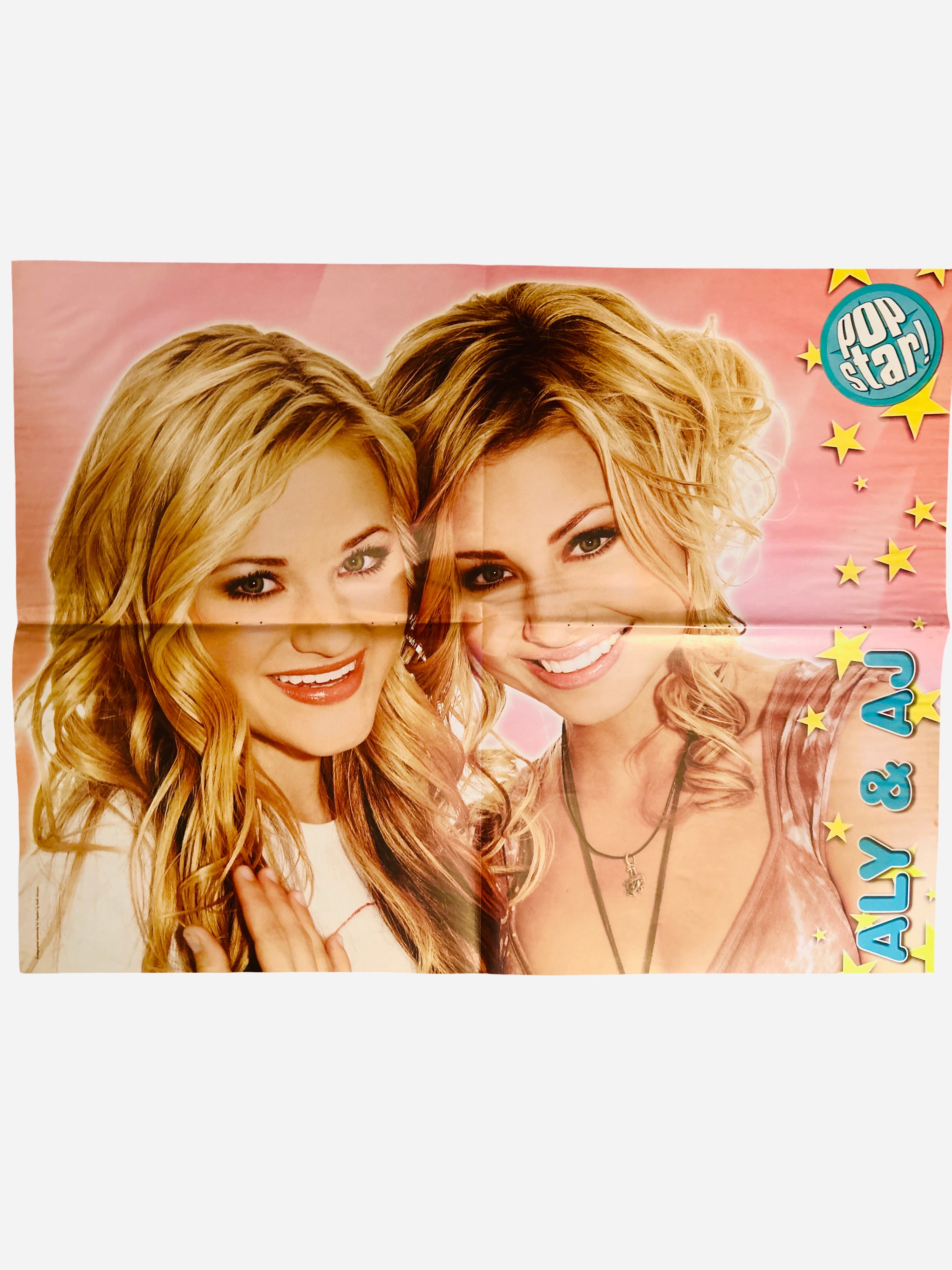 Aly & AJ Pop Star! Magazine poster - front side featuring Aly and AJ smiling together on a pink background with gold stars