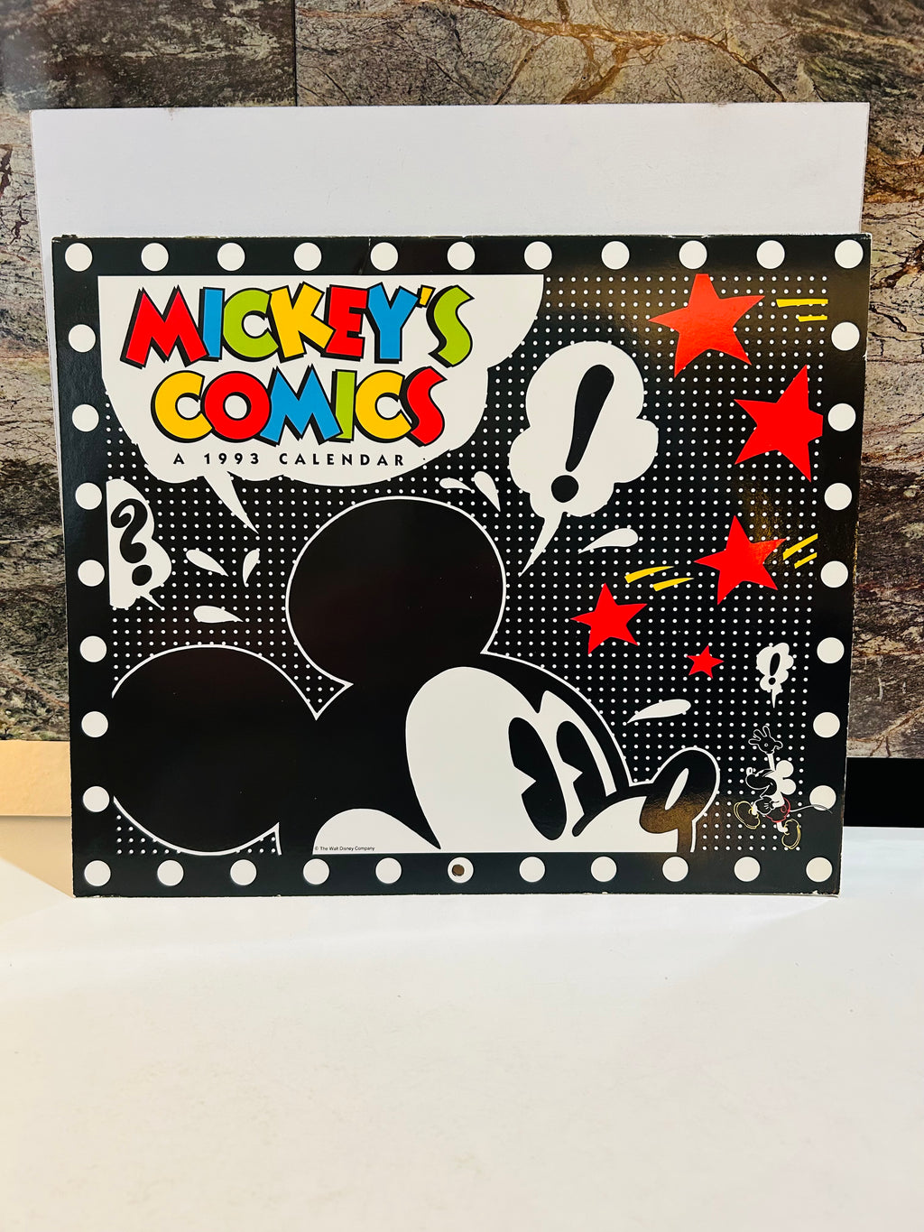 Mickey's Comics A 1993 Calendar front cover – black polka dot background with Mickey Mouse silhouette, colorful comic-style title