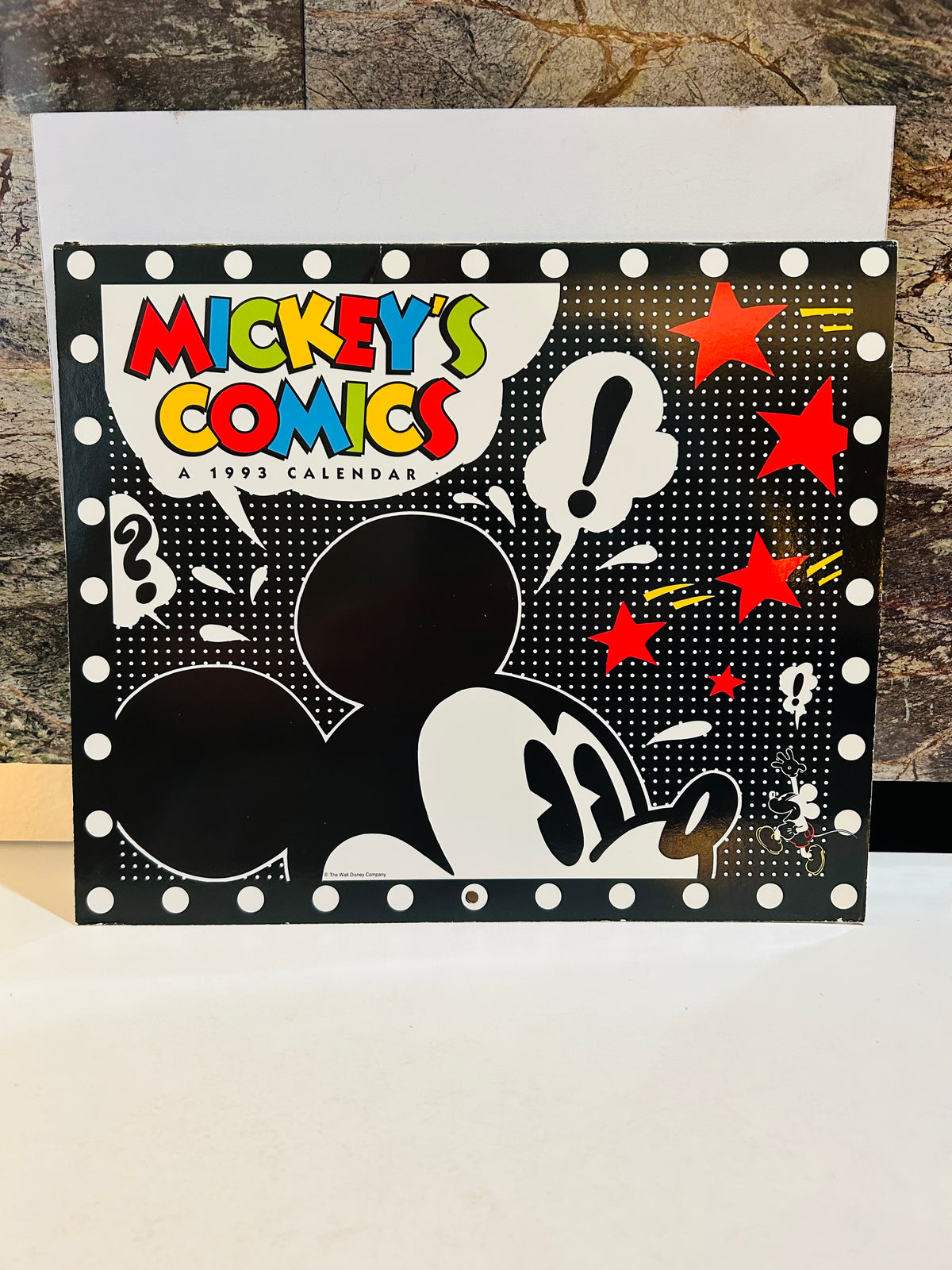 Mickey's Comics A 1993 Calendar front cover – black polka dot background with Mickey Mouse silhouette, colorful comic-style title