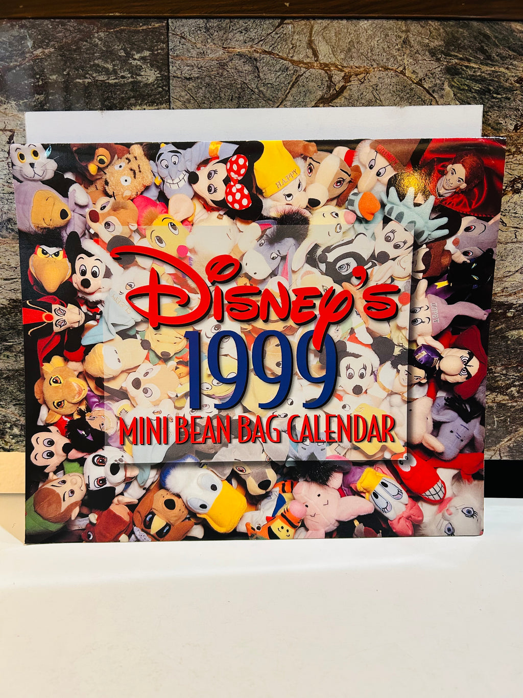 Disney's 1999 Mini Bean Bag Calendar front cover with collage of Disney bean bag plush characters
