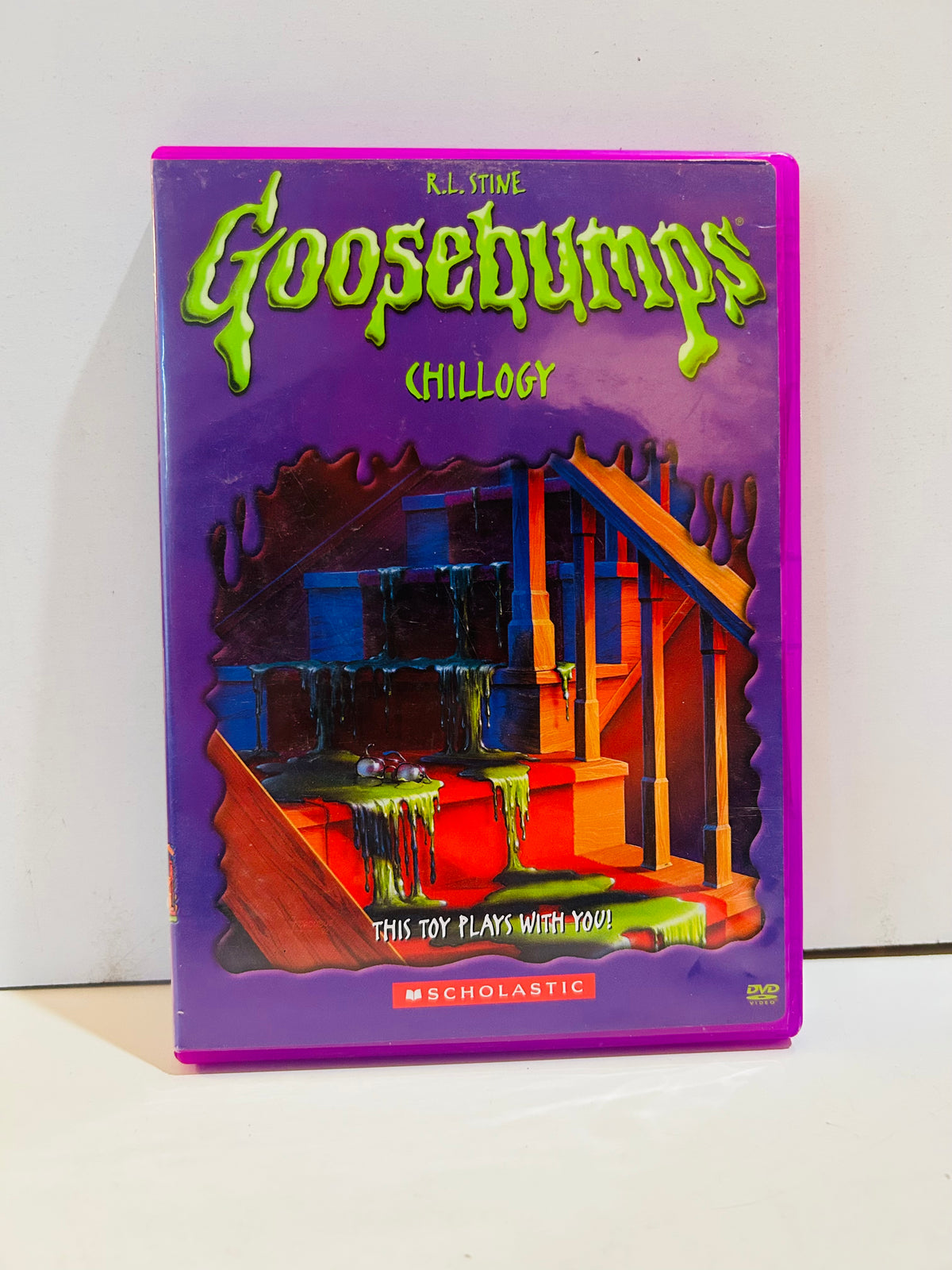 R.L. Stine Goosebumps Chillogy DVD in a purple case with slime-covered staircase artwork