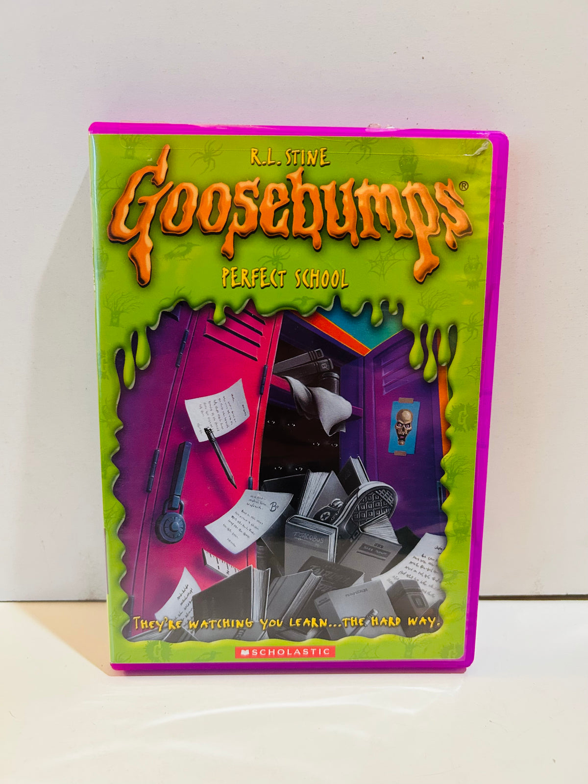 Goosebumps Perfect School DVD in a purple case with green slime artwork and illustrated school lockers