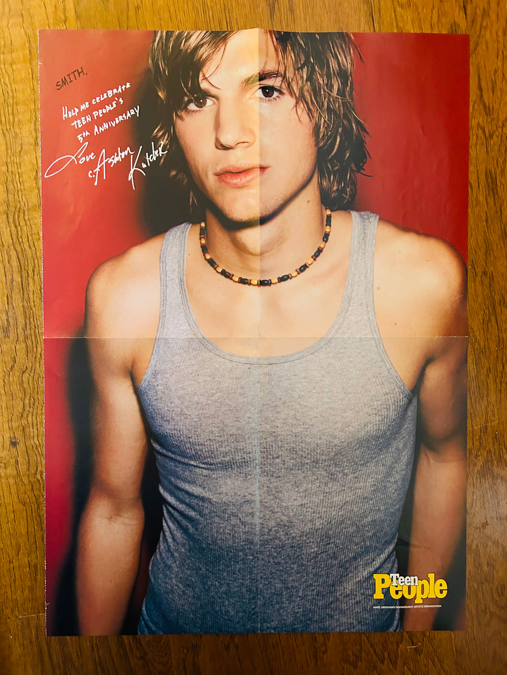 Ashton Kutcher portrait side with printed anniversary message
