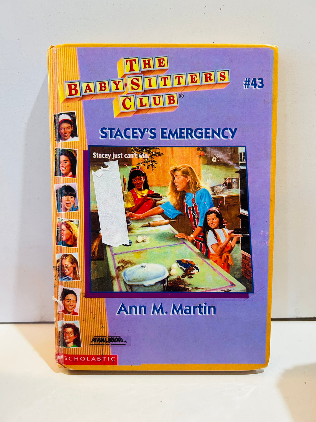 Ex-library hardcover of Stacey's Emergency, Baby-Sitters Club #43, with white label over part of cover illustration
