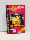 Ex-library hardcover of Claudia and Mean Janine, Baby-Sitters Club book 7, with library stickers visible