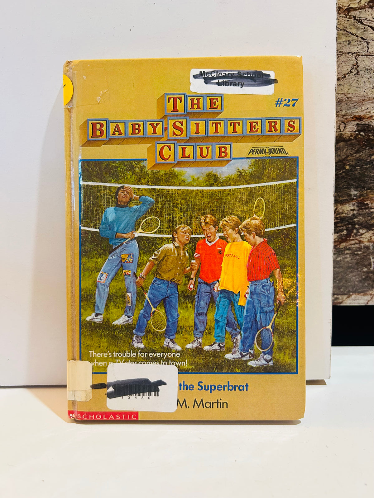 Ex-library hardcover of Jessi and the Superbrat, Baby-Sitters Club book 27, with library label and barcode