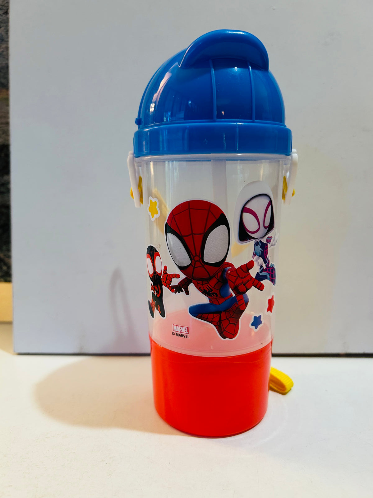 Spider-Man sippy cup with blue lid and red bottom snack container
