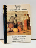 Goodies from Grandmother's House cookbook with black plastic comb binding, kitchen cover photo, and Children's Center San Luis Obispo wording