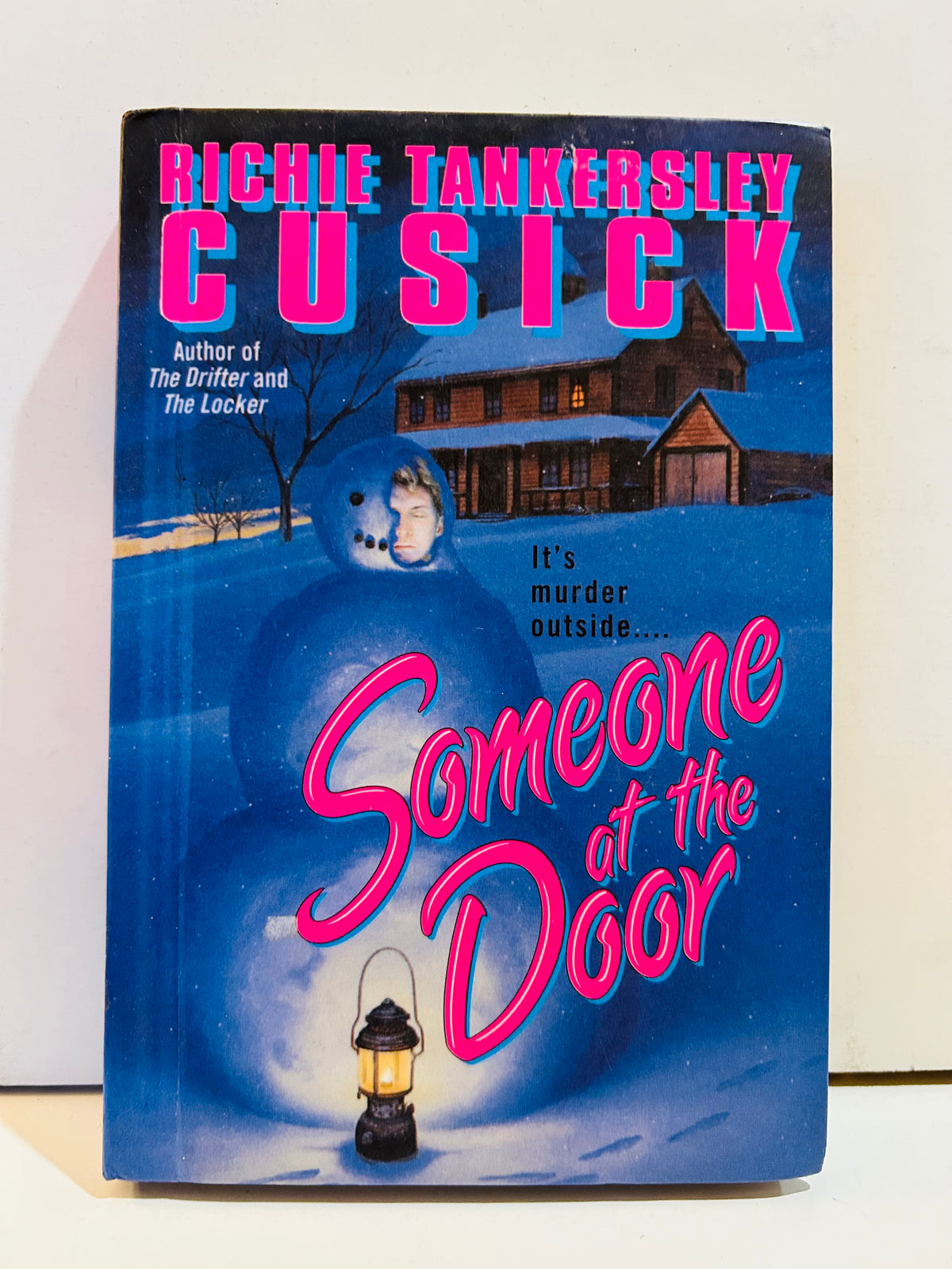 Someone at the Door by Richie Tankersley Cusick hardcover with blue snowy-house artwork and bright pink lettering