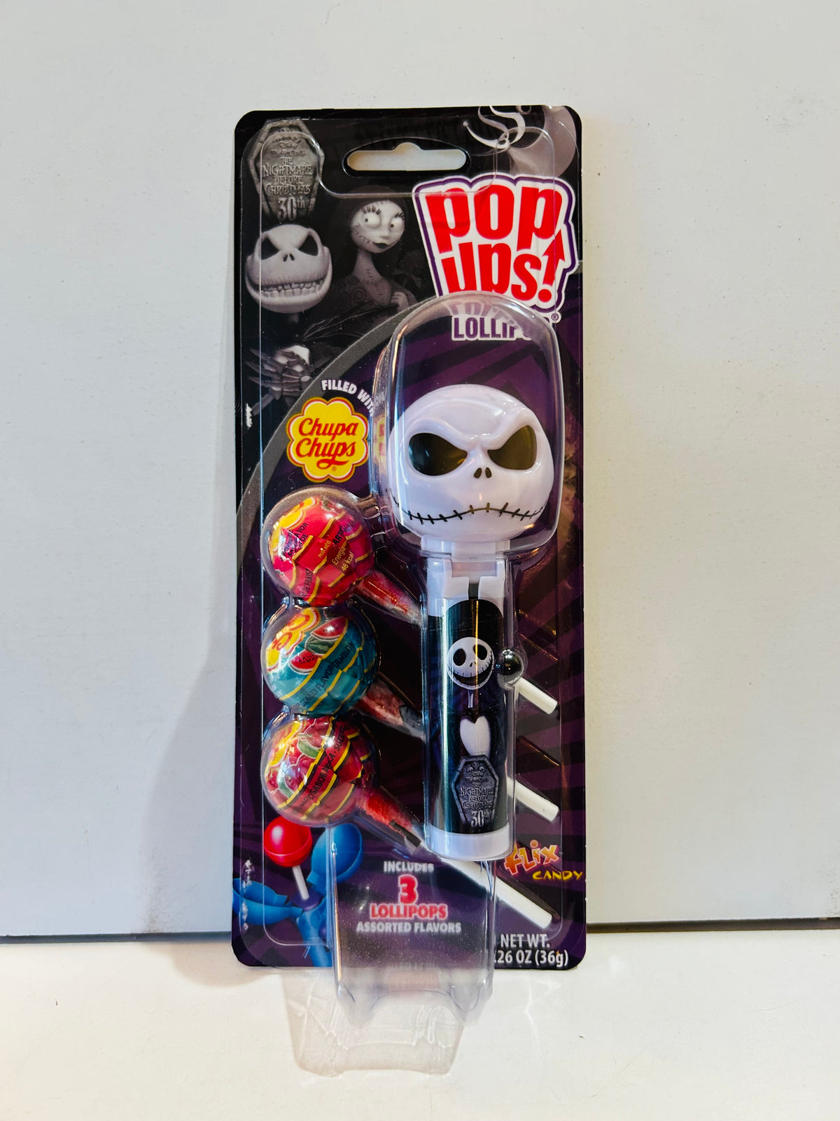 Packaged Jack Skellington Pop Ups lollipop holder with three Chupa Chups lollipops