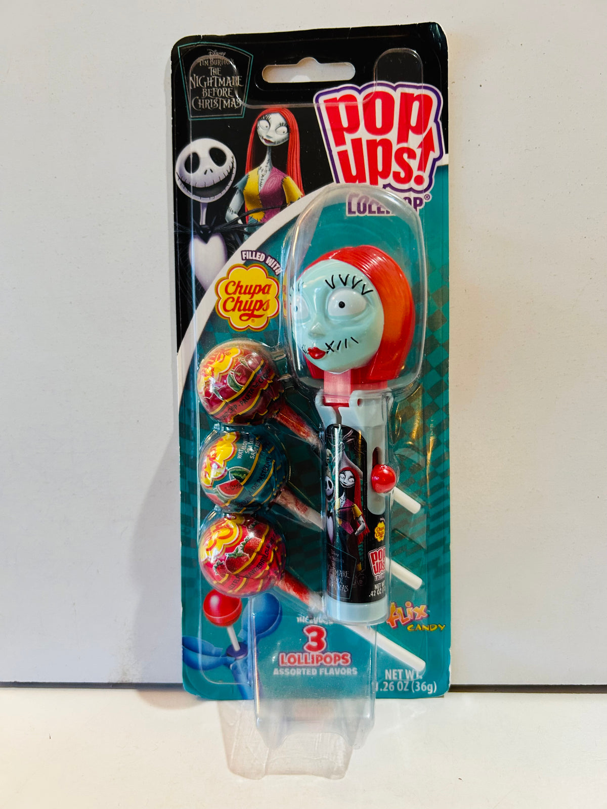Packaged Sally Pop Ups lollipop holder with three Chupa Chups lollipops