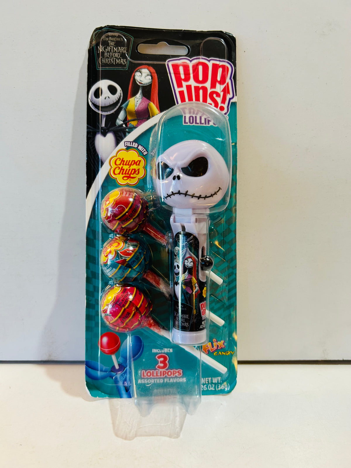Jack Skellington Pop Ups lollipop holder in teal packaging with three lollipops