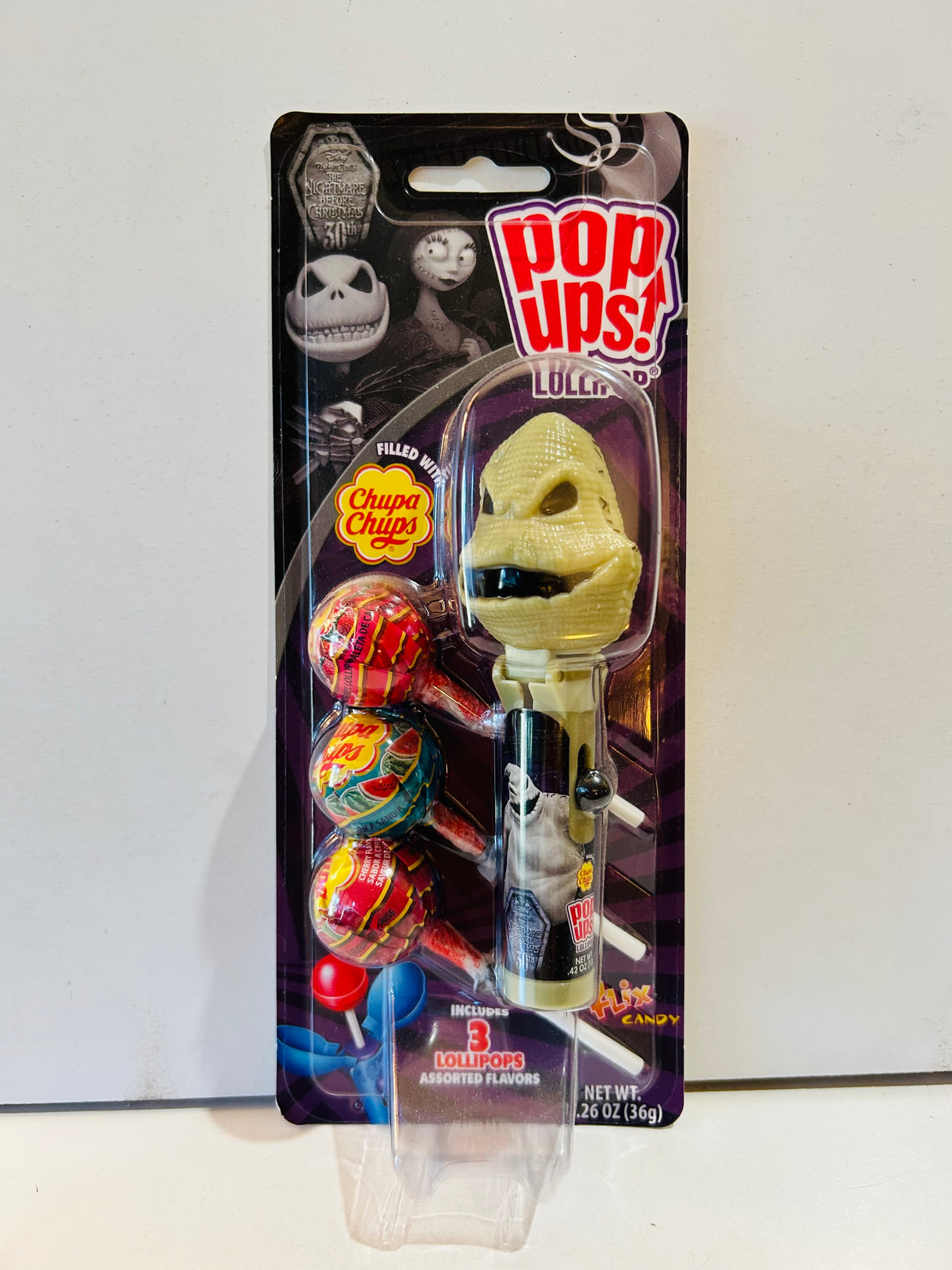 Packaged Oogie Boogie Pop Ups lollipop holder with three Chupa Chups lollipops