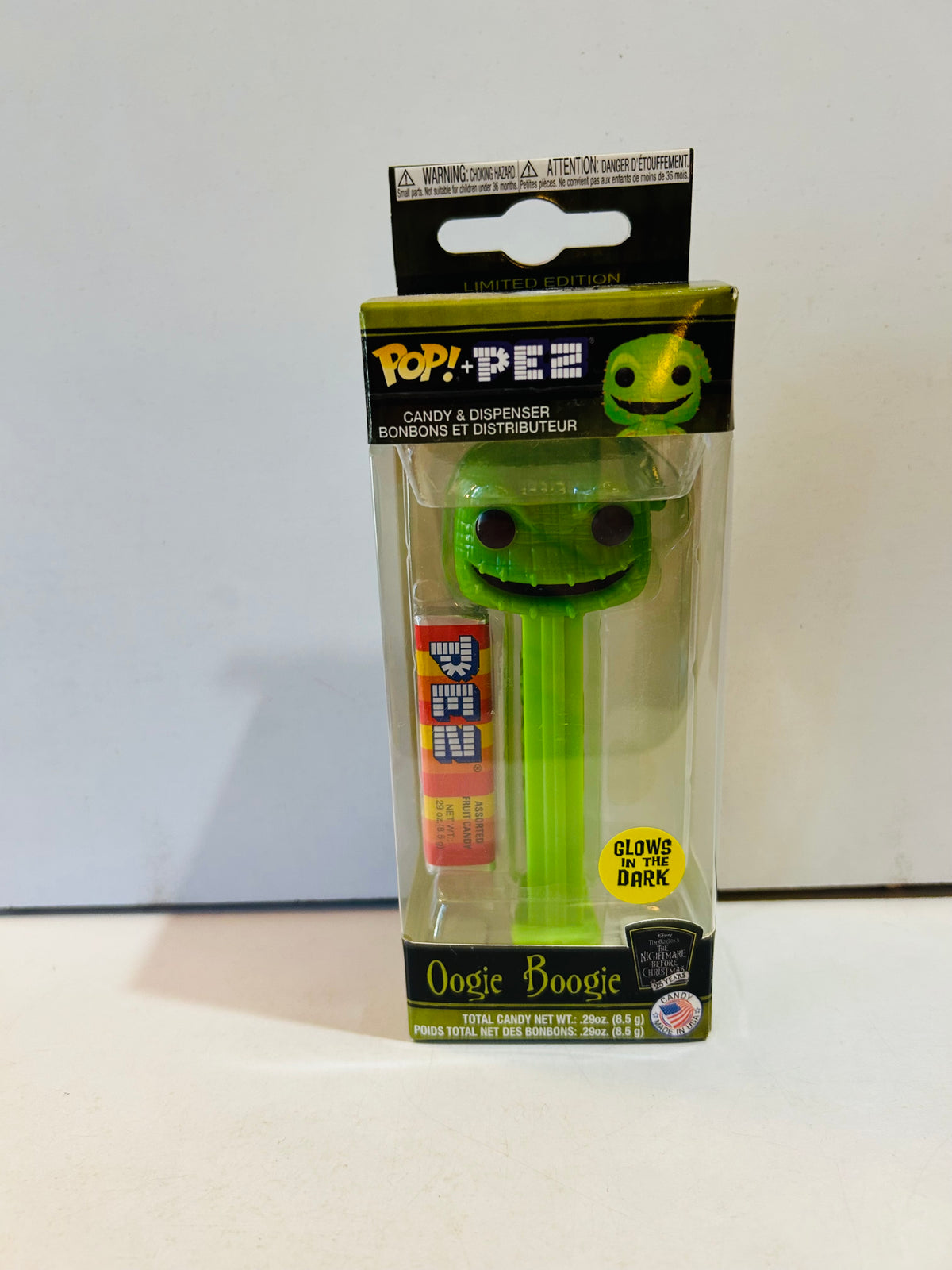 Boxed green Oogie Boogie Funko Pop plus PEZ dispenser labeled glows in the dark