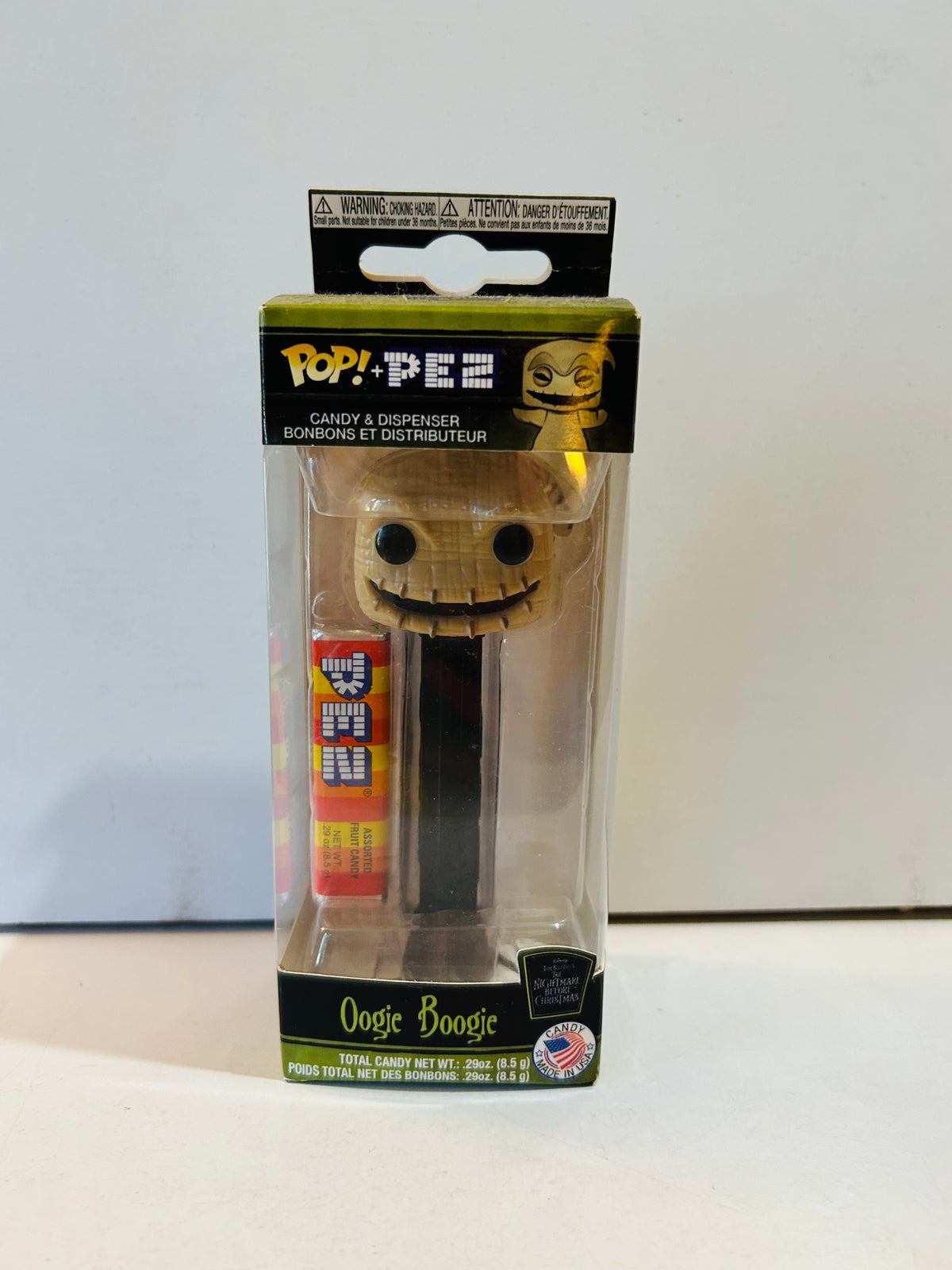 Boxed Oogie Boogie Funko Pop plus PEZ dispenser with black stem and packaged candy