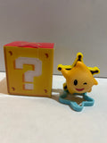 Winking yellow star figure on a blue star-shaped base beside a yellow question-mark block box