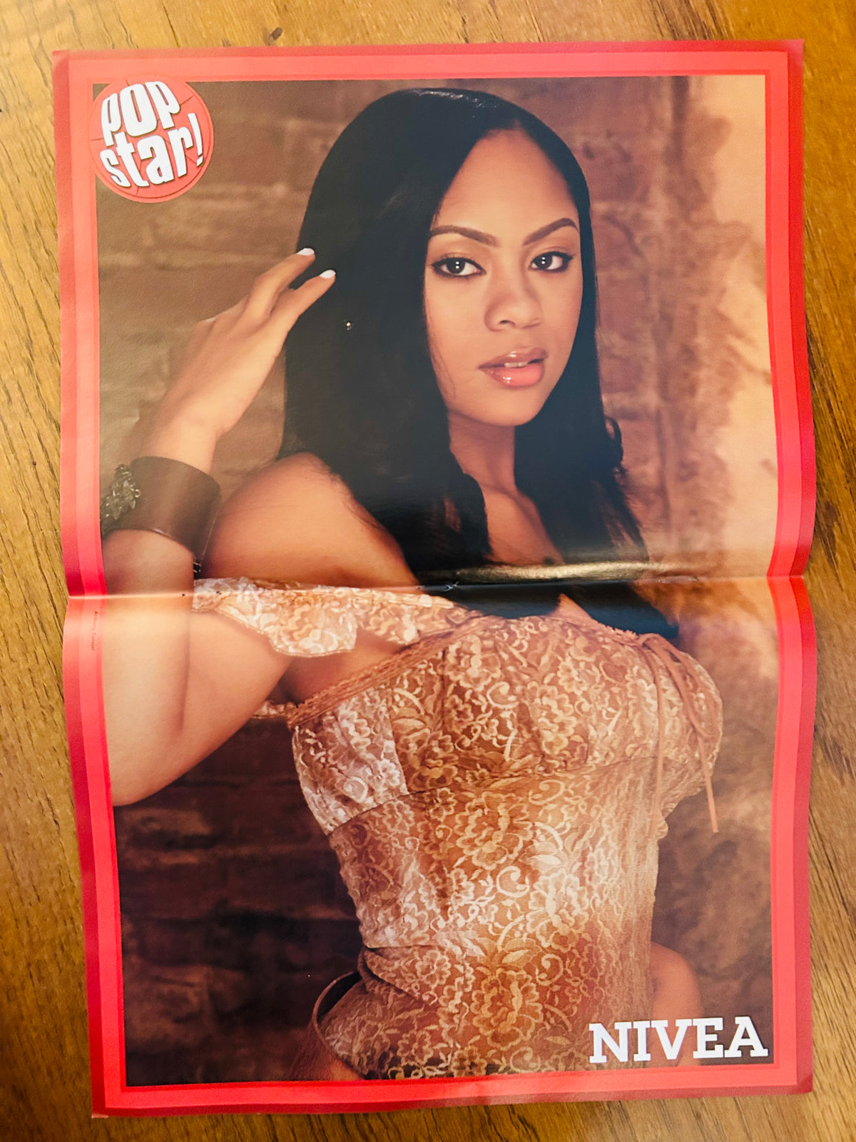 Nivea side of the double-sided Pop Star poster with red border