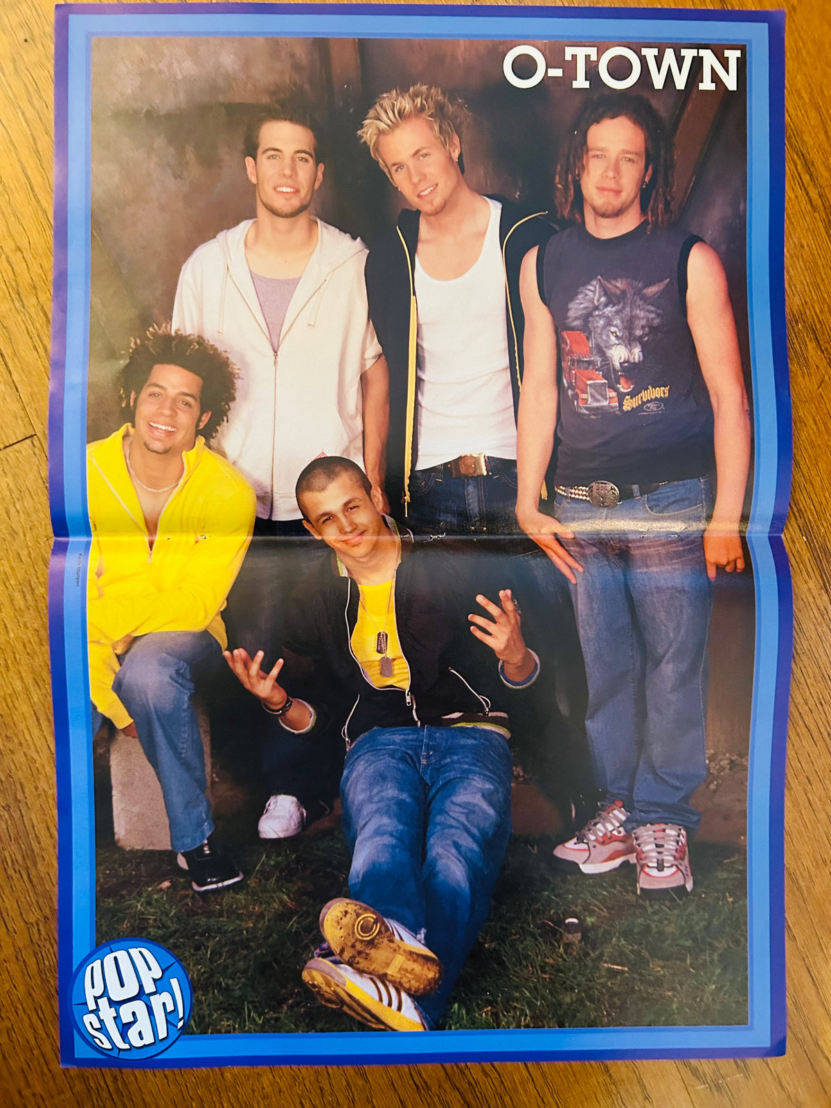 O-Town side of the double-sided Pop Star poster with blue border