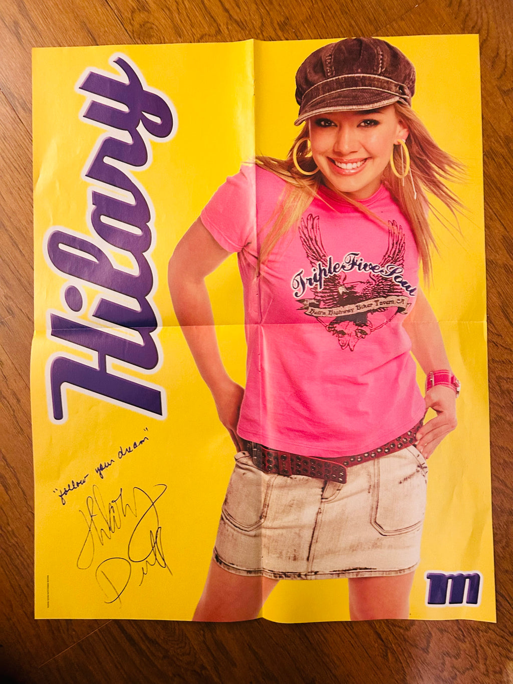 Hilary Duff poster reverse with yellow background, showing fold creases