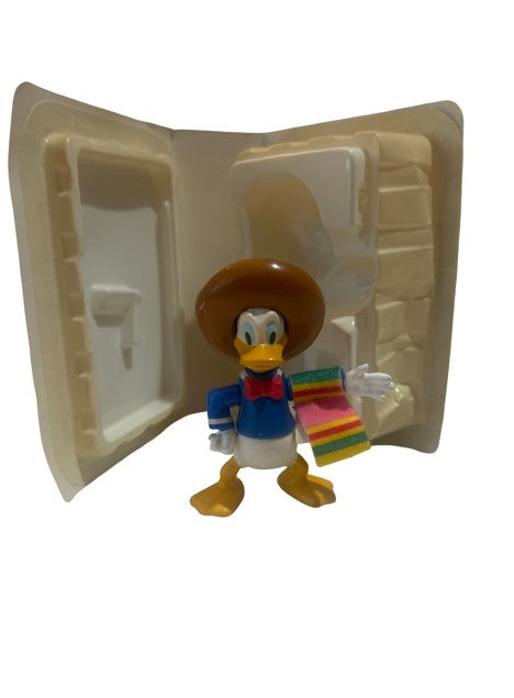 Donald Duck in sombrero and serape PVC figure in open white clamshell case